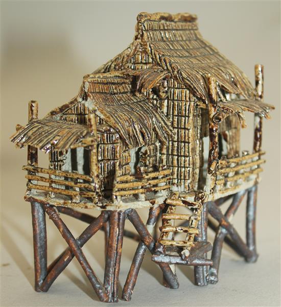 Ten Japanese stoneware models of houses, boats and bridges, early 20th century, tallest 9cm